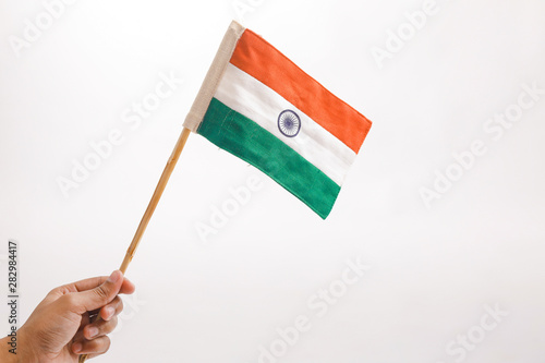 Indian tricolor flag in hand © Niks Ads