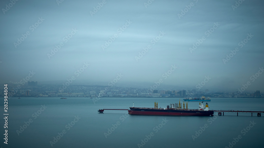 Image of a tanker loading oil on an oil terminal.