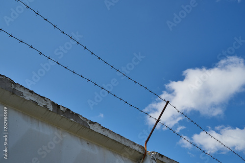 Wallpaper Mural An image of a fence with barbed wire. Torontodigital.ca