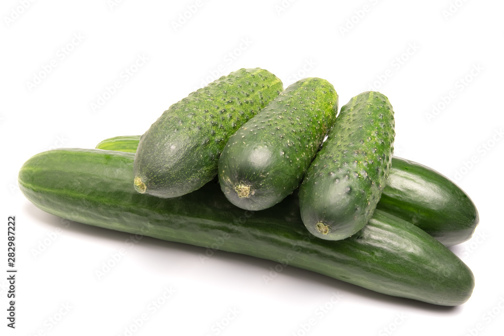 green cucumbers lie on a white background green cucumbers lie on a white background