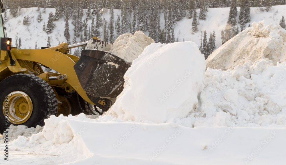 Snow removal with loader machinery after blizzard Snow removal with loader machinery after blizzard