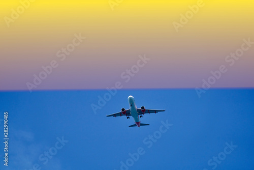 Fototapeta Naklejka Na Ścianę i Meble -  airplane in the air the sunset