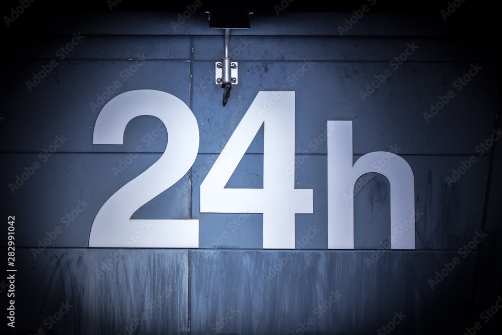 Old 24 hours shop sign which is lighted up in the spooky mood at night in dark. Old 24 hours shop sign which is lighted up in the spooky mood at night in dark.