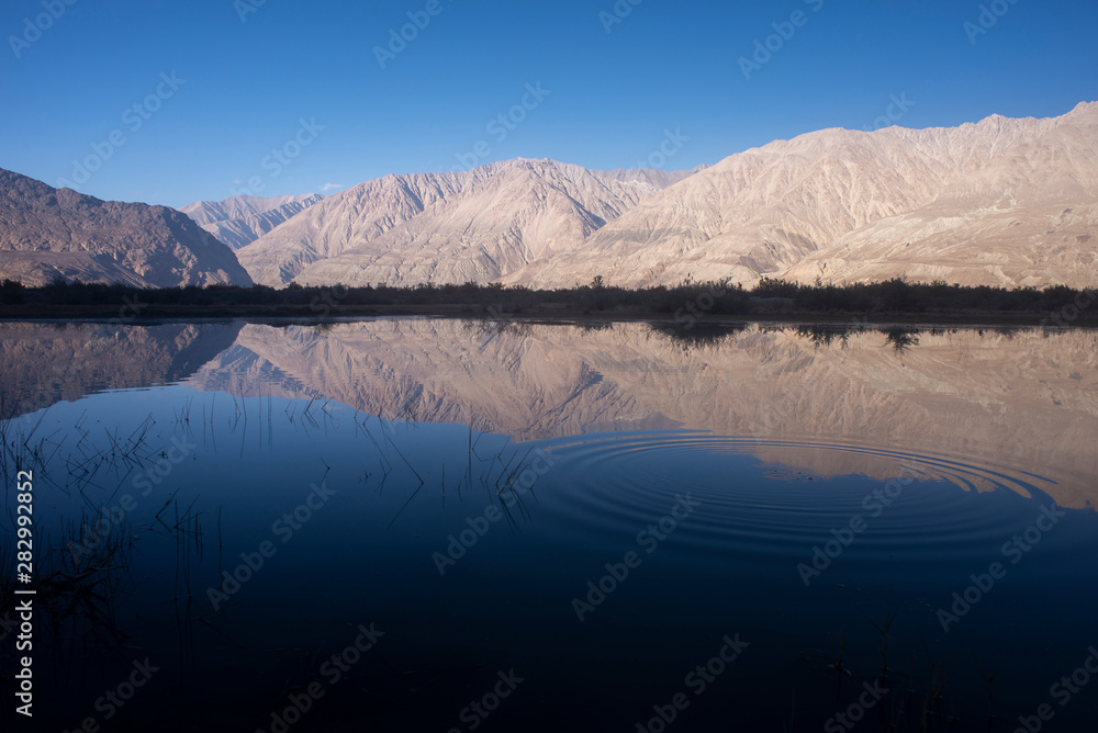 Blue lake with mountains and blue sky background, Ladakh, India
