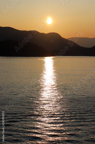 View of sunset off coast of Whytecliff Park, in West Vancouver BC, Canada.