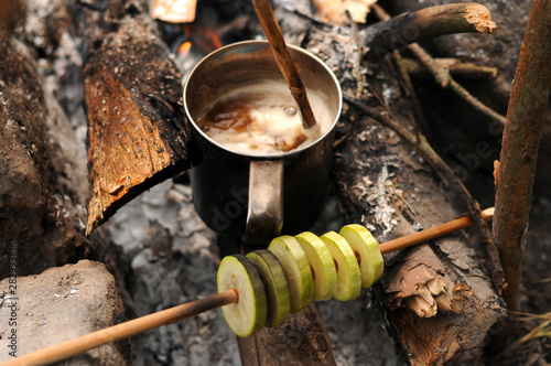 Aromatic and hot coffee on campfire