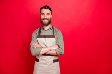 Portrait of his he nice attractive cheerful cheery content bearded guy restaurant fast food owner folded arms isolated over bright vivid shine red background