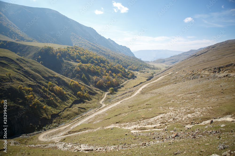 Fototapeta premium Image of mountain terrain, blue clear sky in summer day