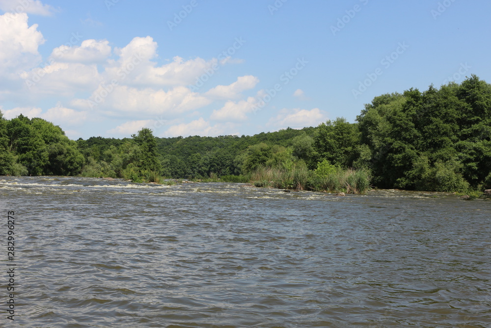 Small rapids on flat rivers attract tourists and travelers in the summer Small rapids on flat rivers attract tourists and travelers in the summer