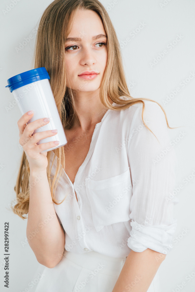 Girl holding a useful reusable glass for comparison Girl holding a useful reusable glass for comparison