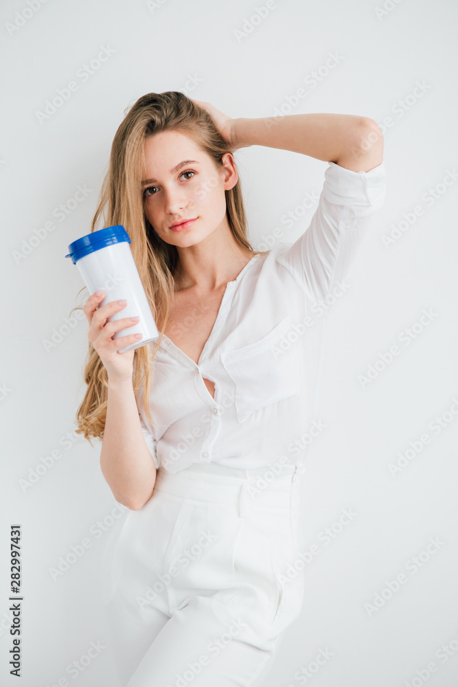 Girl holding a useful reusable glass for comparison Girl holding a useful reusable glass for comparison