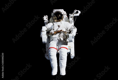 The astronaut in a space suit, in an outer space, without insurance, isolated on a black background. Elements of this image were furnished by NASA