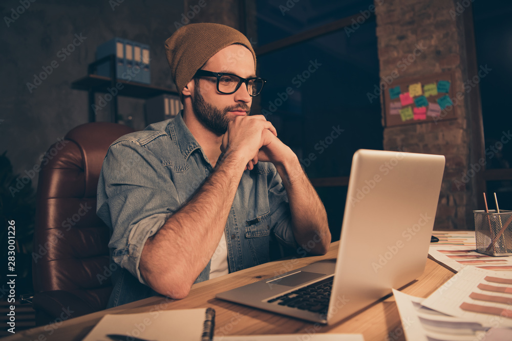 Photo of attentive guy work at dark time watch notebook online lesson wear casual outfit sit modern office Photo of attentive guy work at dark time watch notebook online lesson wear casual outfit sit modern office