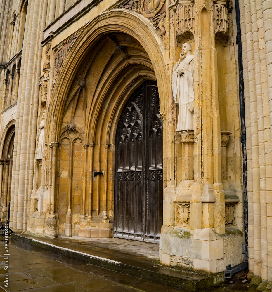 A close up of the grand entrance, and large wooden doors, to the Cathedral