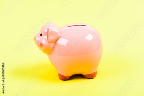 financial problem. piggy bank on yellow background. income management. money saving. planning budget. Budget limit concept. Budget crisis. Financial wellbeing. Money and power