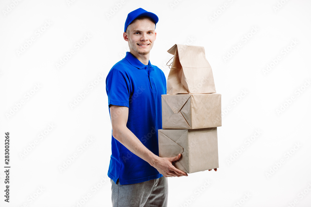 Delivery guy has a stack of boxes in hands. Delivery guy has a stack of boxes in hands.