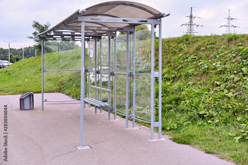 A bus stop for public transport in the city on an overcast summer morning A bus stop for public transport in the city on an overcast summer morning