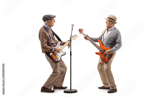 Two elderly men having a jam session with electric guitars © Ljupco Smokovski