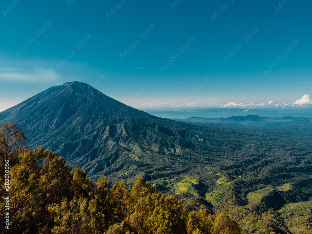 Aerial view of Agung volcano and mountain with forest in Bali