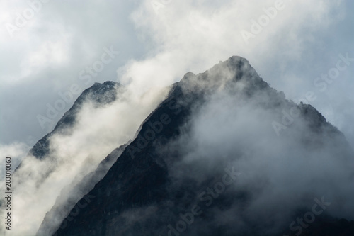 Mountain peaks in mist, North Sikkim, India