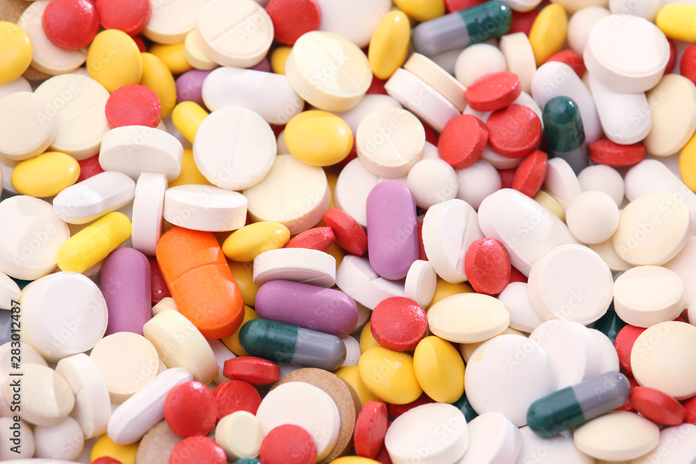 Different colorful tablets at white background Different colorful tablets at white background