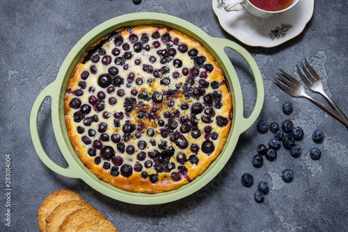 Blueberry shortcake tart, pie in silicone baking dish, on grey background