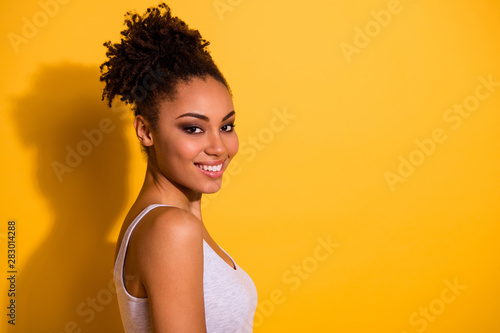 Close up side profile photo beautiful funny she her dark skin lady show white perfect ideal teeth carefree weekend vacation summer street look wear casual tank-top isolated vivid yellow background