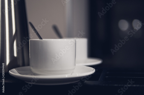Fototapeta Naklejka Na Ścianę i Meble -  two white ceramic cups with coffee