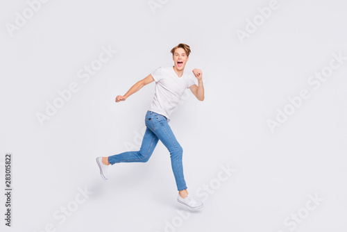 Full size photo of jumping high guy speed race participant wear casual outfit isolated white background © deagreez