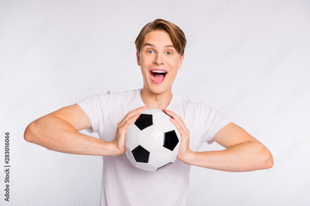 Photo of attractive guy holding big playing ball cheering favorite team wear casual outfit isolated white background