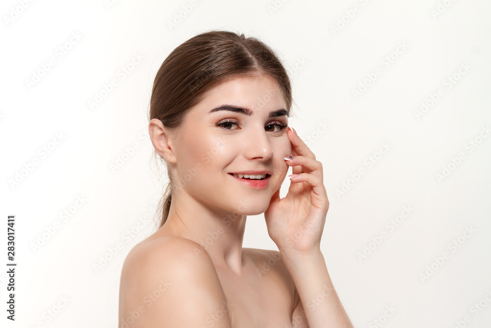 Close-up portrait of a happy beautiful young girl isolated over white background.