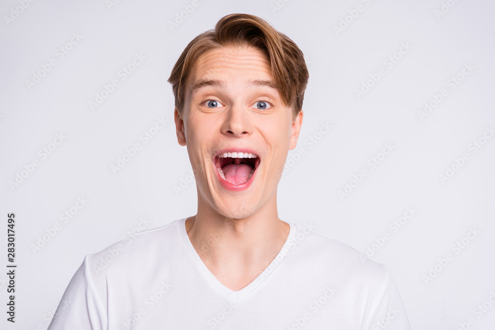 Close-up portrait of his he nice cute attractive cheerful cheery glad excited ecstatic guy opened mouth isolated over light white pastel background Close-up portrait of his he nice cute attractive cheerful cheery glad excited ecstatic guy opened mouth isolated over light white pastel background