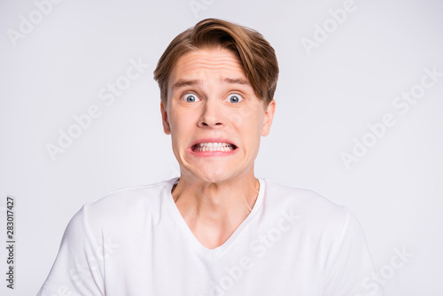 Close-up portrait of his he nice cute attractive worried confused guy don't know oops fail failure isolated over light white pastel background