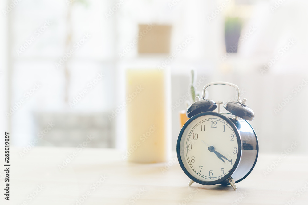 Morning sun. Alarm clock on a beautiful background Morning sun. Alarm clock on a beautiful background