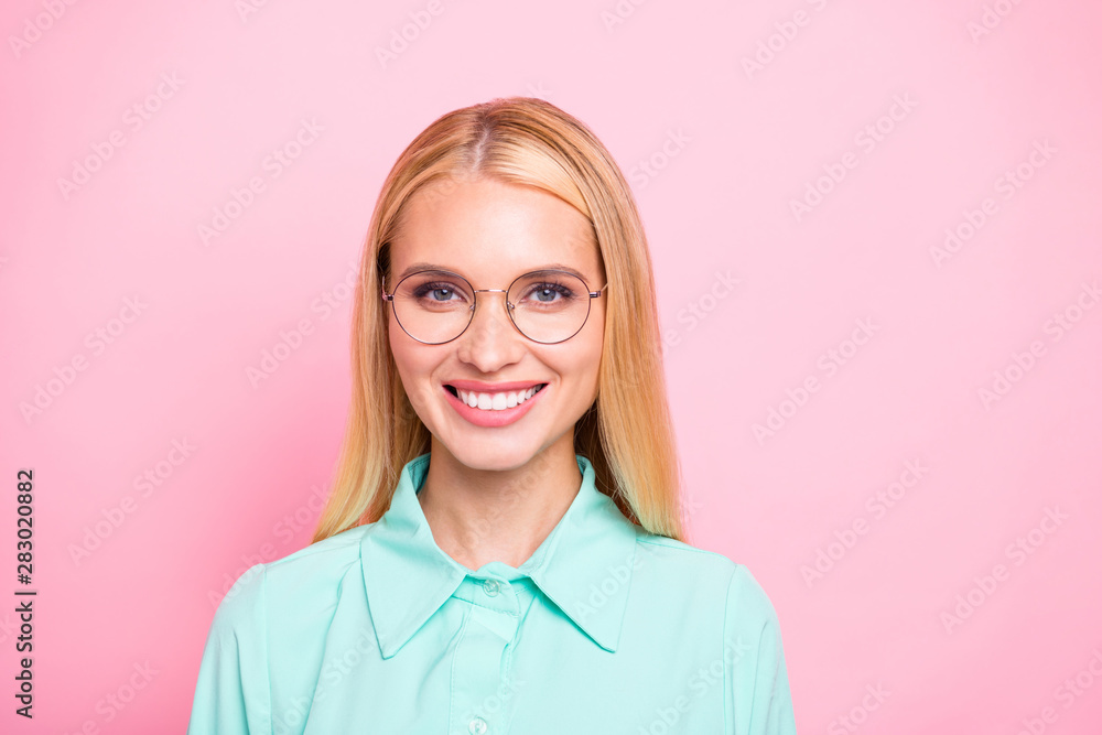 Close up photo of cute lovely girl with beaming smile wearing teal turquoise shirt isolated over pink background Close up photo of cute lovely girl with beaming smile wearing teal turquoise shirt isolated over pink background