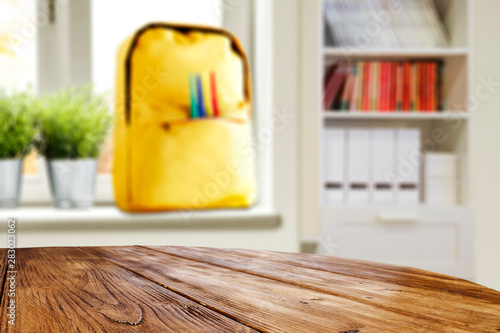 School interior and table background with window view in distance.