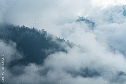 Mountains peaks in mist in North Sikkim, India © pomiti