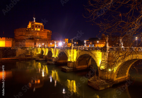 Night view of bridge and Castel Sant Angelo in Rome , Italy 