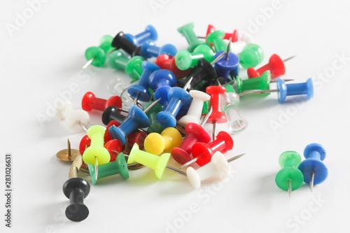 Colorful thumb tack on the white background