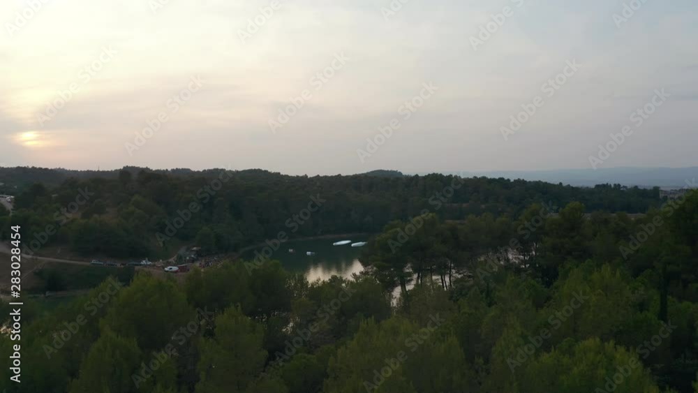 Aerial view discover a nautical lift in Carcassonne during a beautiful sunset, lac de la cavayère Aerial view discover a nautical lift in Carcassonne during a beautiful sunset, lac de la cavayère