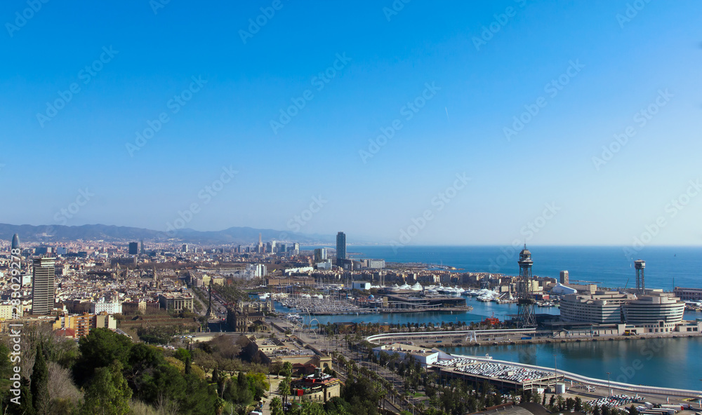 Landscape photo of the Barcelona marina bay and seaport. View from Montjuïc
