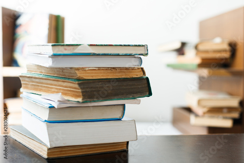 Education concept. Stack of books on table.