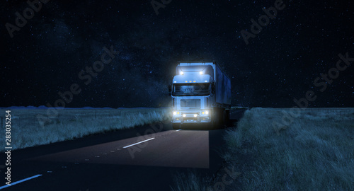 Long Haul overnight Trucking Logistics on a dark country highway road photo