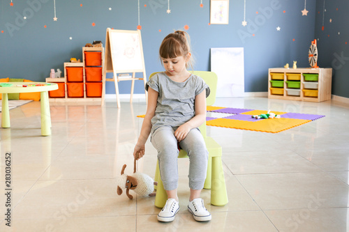 Sad little girl with autist...