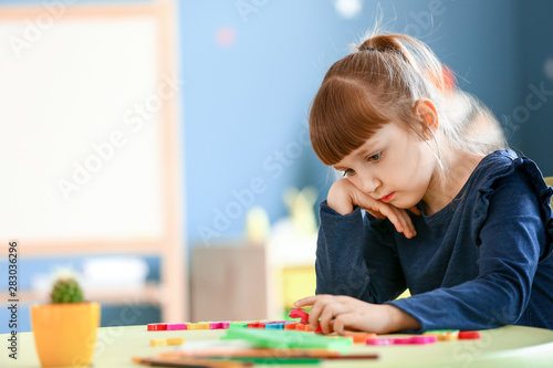 Tableau sur toile Little girl with autistic disorder in playroom