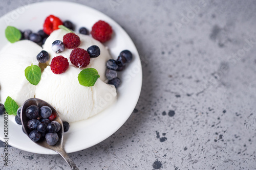 Vanilla ice cream sundae with fresh summer berries