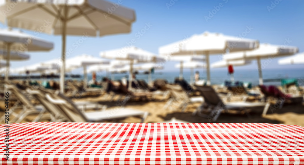 Table background with blurred restaurant view. Empty space for advertising products and decoration.