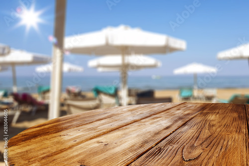 Table background with blurred restaurant view. Empty space for advertising products and decoration.