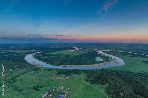  The river winds across the steppe. Evening/ Russia
