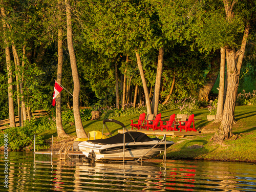 motorboat docked at cottage photo